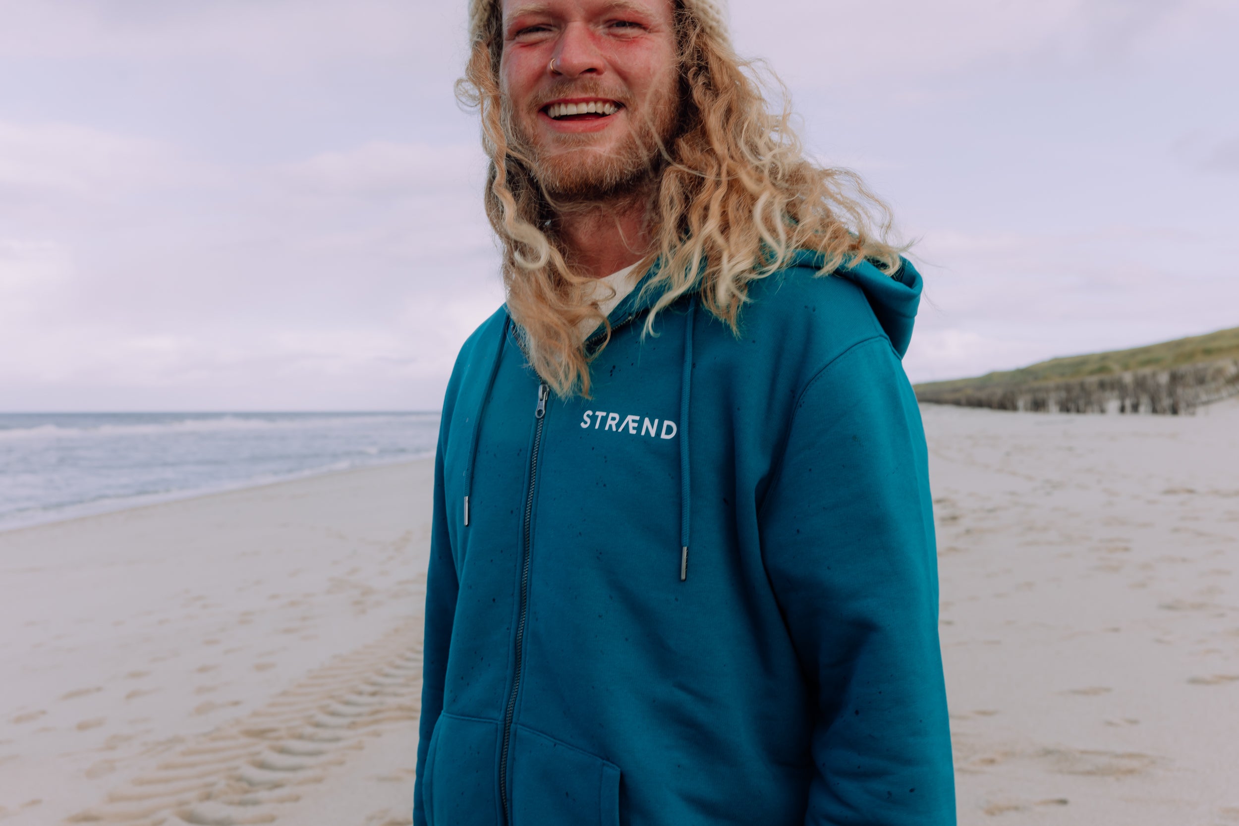 Hoodie in Pfauengrün mit Sonne in weiss, unisex